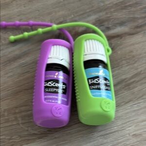 Young Living Kidscents Sniffleease & Sleepyize With Holders. 

Both 5ML and new.